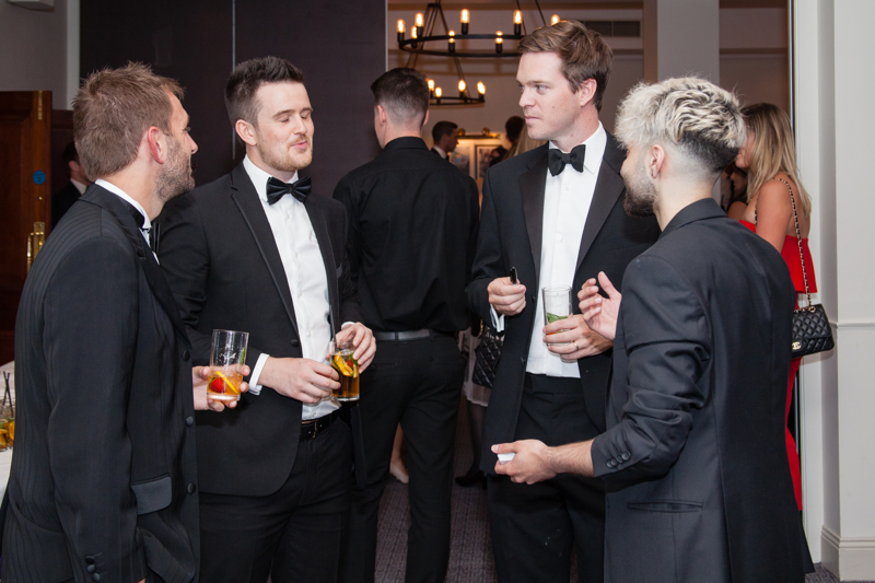 magician showing group of people a trick